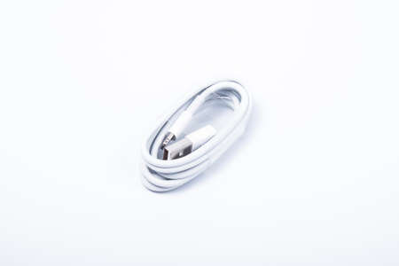 USB lightning cable for a smartphone on white background.の写真素材