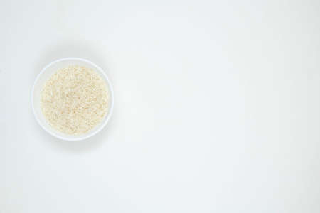 Bowl of long grain white rice, isolated on white background. Copy space.の写真素材