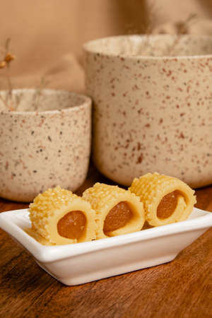 Close-up of delicious homemade pineapple roll tart for eid fitr on a with plateの写真素材