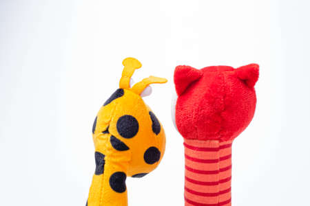 Little yellow giraffe and red fox soft toys isolated on white background. copy spaceの写真素材