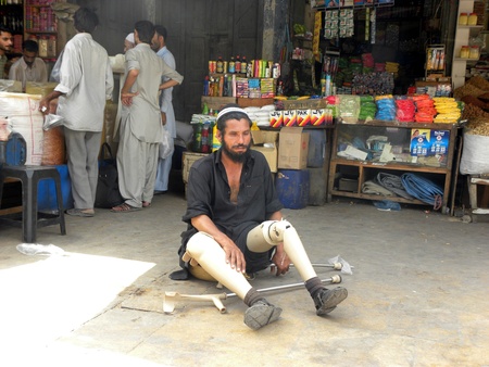 PAKISTAN/KARACHI_DISABLED BEGGAR SITTING IN THE MIDDLE OF MARKET TODAY ON TUESDAY  8 MAY 2012 IN...