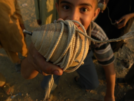 karachi pakistan_a young boys hold in his hand spintop spintop is traditional game in pakistan for...