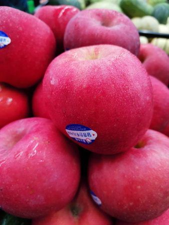 Ripe red apples on the counter in the supermarket, close-upの写真素材