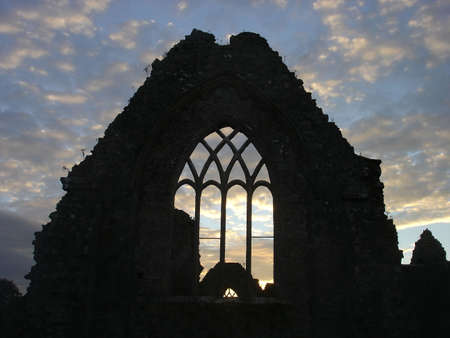 Sunset through the ruins of Athenry Abbey in County Galway, Irelandの写真素材