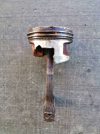 Used, oily and broken piston headの写真素材