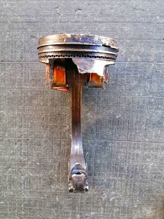 Used, oily and broken piston headの写真素材