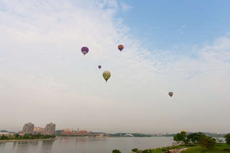 PUTRAJAYA, MALAYSIA - MARCH 18 : Hot air balloons flying in space at putrajaya during 3rd Putrajaya International Hot Air Balloon Fiesta March 18, 2011 in Putrajaya, Malaysia.のeditorial素材