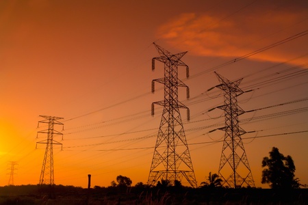 Electricity pylons at sunsetの写真素材