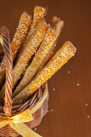 Puffed pastry with cheese and sesame in thebasketの写真素材