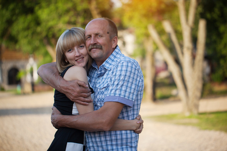 Father and the adult daughter embrace, a happy family. Family conseptの写真素材