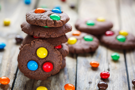 Homemade  chocolate cookies decorated with multi-colored candy dropsの写真素材