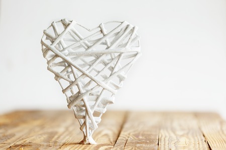 White heart handmade of rods on a white background. Valentine's Day.の写真素材