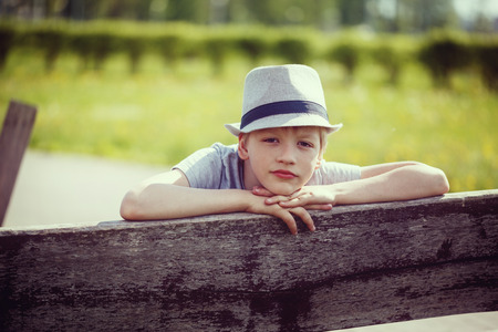 Young attractive handsome boy wearing a hatの写真素材