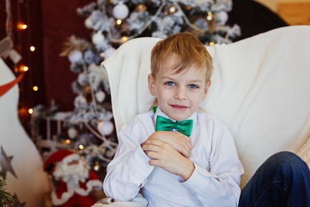 Portrait of cute young smiling boy, indoorの写真素材