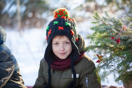 Portrait of a boy walking in the winter nature.の写真素材