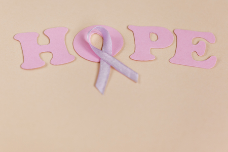 Inscription word hope and ribbon on background.の写真素材