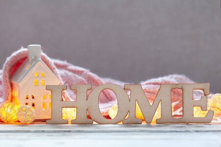 Still life home decor with wooden letters with the inscription home. Concept comfort and decor in a house .の写真素材