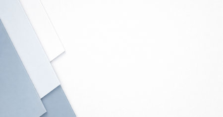 White and blue paper background with copy space. Flat lay, top view.の写真素材