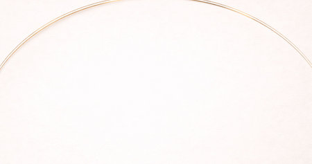 golden line on white paper background with copy space for text or imageの写真素材