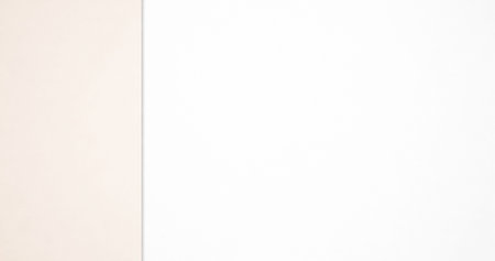 White and beige paper background with copy space for text or imageの写真素材