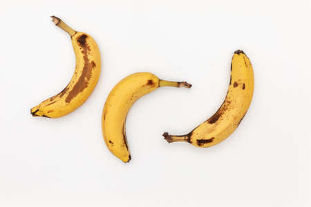 three fresh Bananas are Isolated on a white background.の写真素材