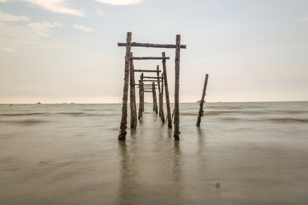Old wooden bridge on the beachの写真素材