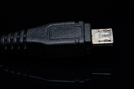usb cable isolated on blackの写真素材