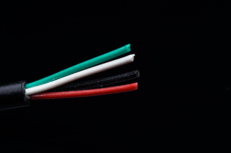 multi color of electric wire isolated on blackの写真素材