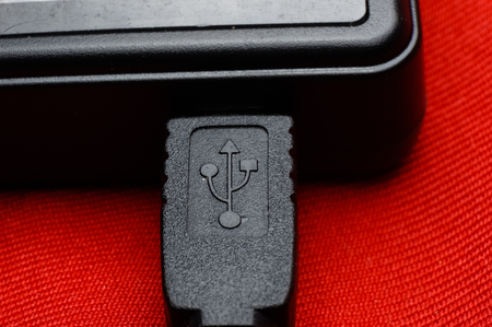 close up of usb cable connected with phone