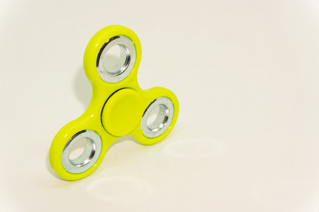 fidget finger spinner isolated on whiteの写真素材