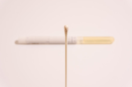 medical strile transport swab stick isolated on whiteの写真素材