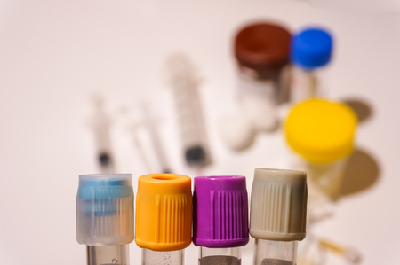 Close up view of blood tube cap with blurry background of medical equipmentの写真素材