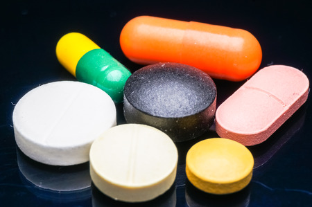 colorful of medication isolated on blackの写真素材