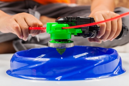 closeup shot of spinning top of metal and plastic fusion