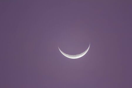 closeup shot of a beautiful half moon in the morningの写真素材
