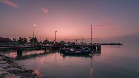 majestic sunrise over fisherman's jetty area in malacca, malaysia