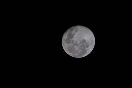 closeup shot of a full moon at nightの写真素材