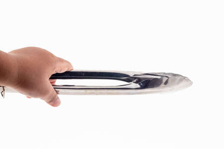 closeup shot of a stainless steel food clip isolated on white backgroundの写真素材