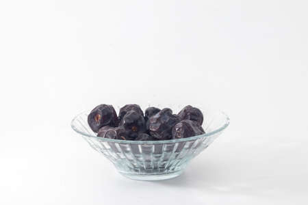 closeup shot of a dates isolated on white background.conceptual image of islamic cultureの写真素材