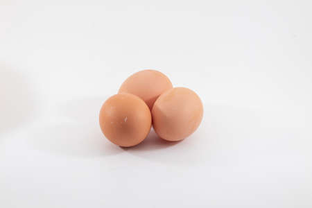 closeup view of a chicken egg isolated on white backgroundの写真素材