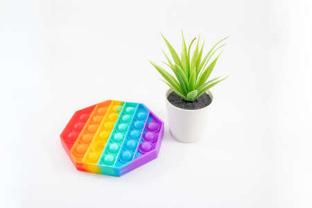 view of anti-stress toys pop it on white background. Concept trendy entertainment for fidget...