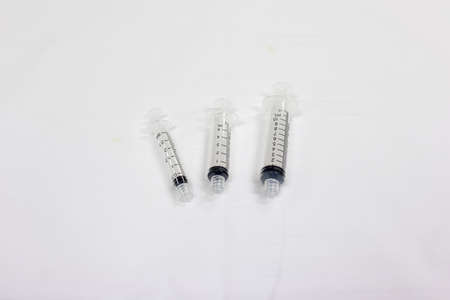 closeup view of a syringe and needle on white backgroundの写真素材