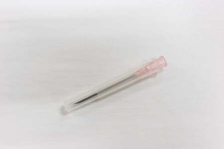 closeup view of a syringe and needle on white backgroundの写真素材