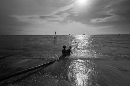view of a sand beach during a summer day in black and whiteの写真素材
