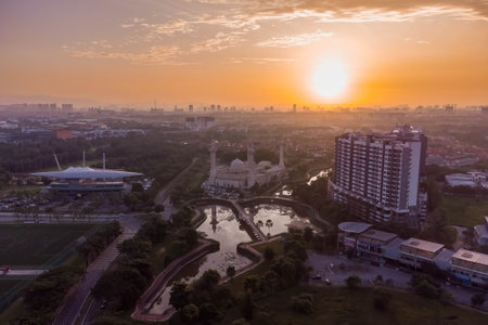 aerial view of a Bukit Jelutong Mosque in Malaysia with sunrise sceneの写真素材