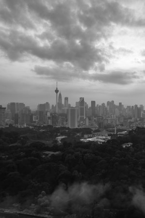 Modern skyscrapers pierce the hazy morning sky over Kuala Lumpur.の写真素材