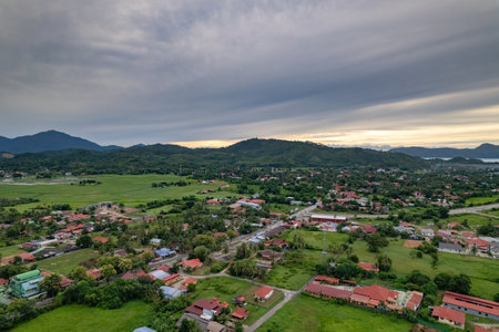 Panoramic view of Langkawi's urban sprawl, showcasing residential and commercial development nestled amidst lush greenery.の写真素材