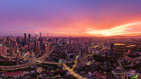 Urban sprawl meets vibrant twilight in this aerial perspective of Kuala Lumpur.の写真素材