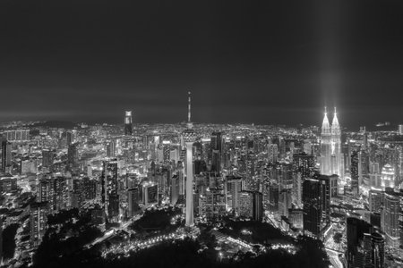Kuala Lumpur's vibrant skyline at night, a dazzling display of illuminated skyscrapers.の写真素材