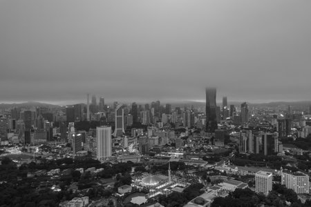 Low clouds drape over the city, creating a serene atmosphere.の写真素材
